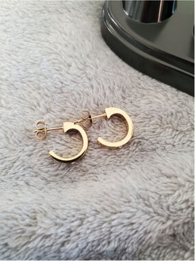 Gold tone Love Hoop Earrings with diamond like style. 1/2 inch